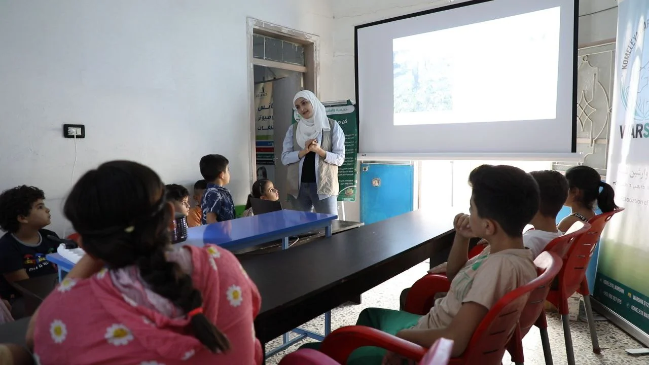 Children participating in an environmental classroom workshop